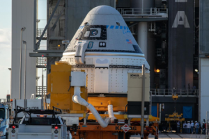 Nov. 21, 2019 - A transporter carrying the Boeing CST-100 Starliner spacecraft arrives at the Vertical Integration Facility, Space Launch Complex 41, Cape Canaveral Air Force Station, Florida. Credits: NASA/Kim Shiflett